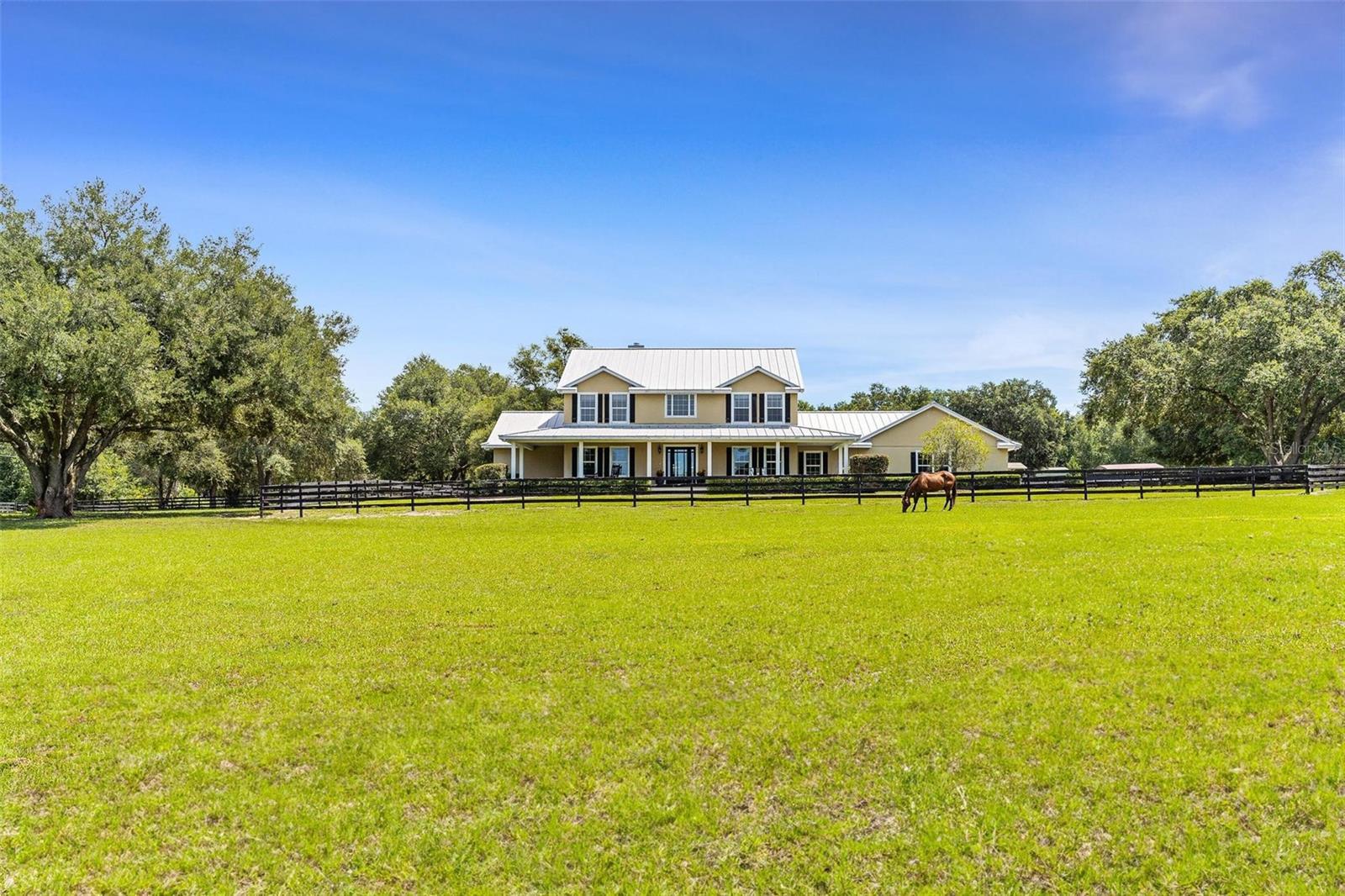two story ranch home with large grass property